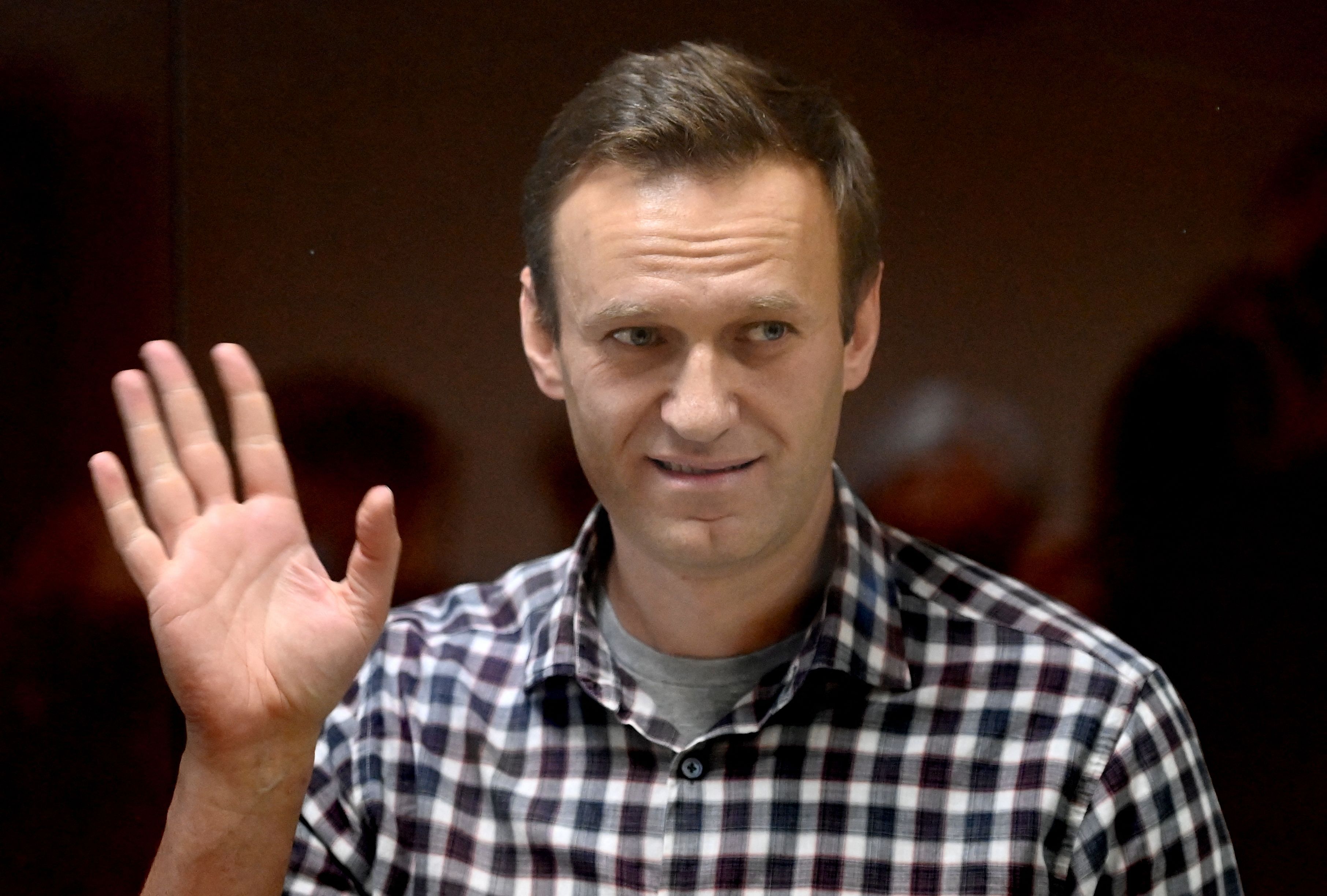  Russian opposition leader Alexei Navalny stands inside a glass cell during a court hearing at the Babushkinsky district court in Moscow on February 20, 2021. Credit: AFP File Photo
