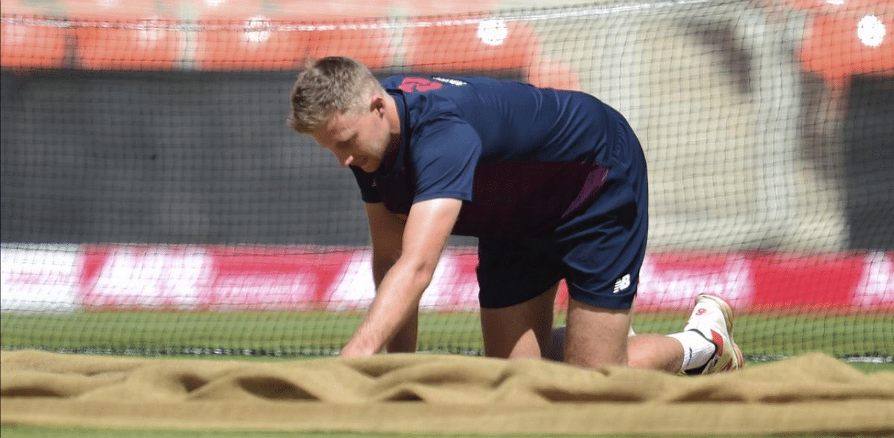England skipper Joe Root inspects the pitch ahead of the 4th and last test match of the series between India and England, in Ahmedabad. Credit: PTI photo. 