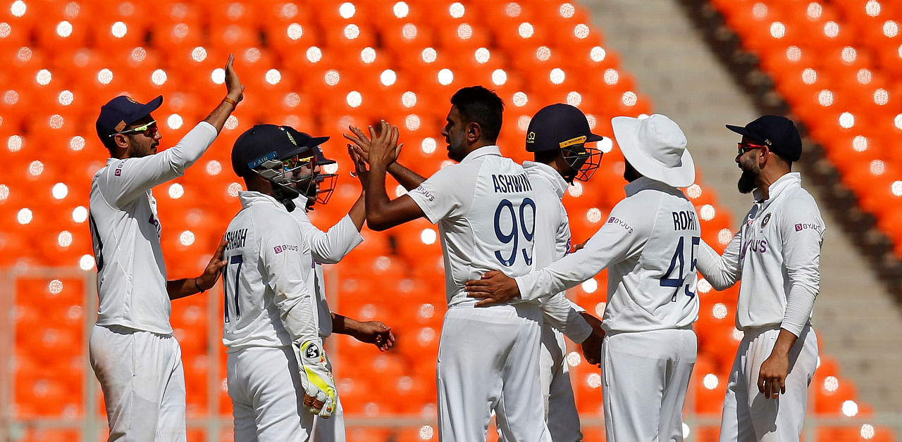 Ravichandran Ashwin celebrates with his teammates after dismissing England's Ollie Pope. Credit: Reuters Photo