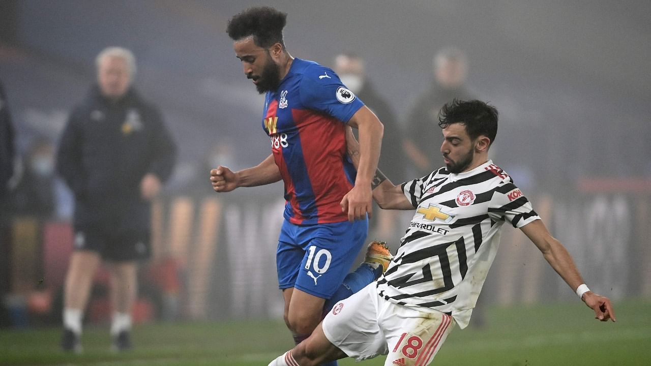 Manchester United's Bruno Fernandes (R) vies for the ball with Crystal Palace's Andros Townsend during their goalless draw at Selhurst Park, London. Credit: Reuters Photo