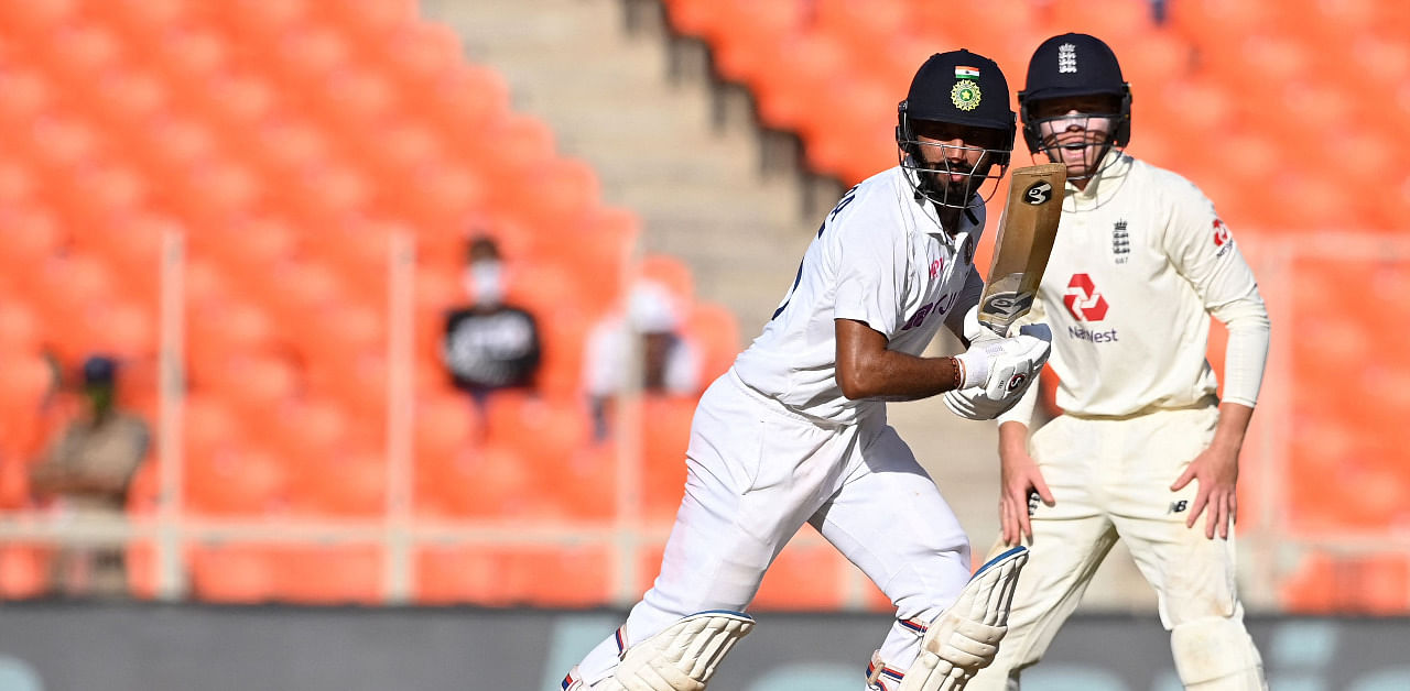 Cheteshwar Pujara plays a shot on the first day of the fourth Test cricket match between India and England at the Narendra Modi Stadium. Credit: AFP Photo