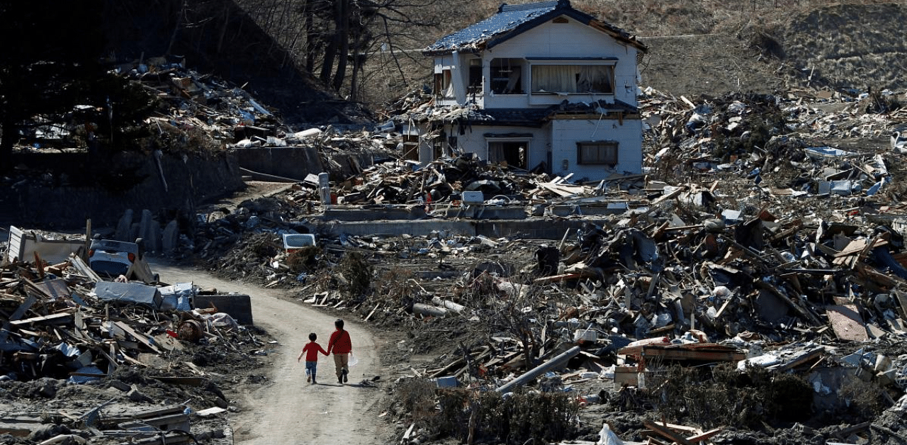 People walk at an area that was damaged by the March 11 earthquake and tsunami, in Miyako. Credit: Reuters Photo