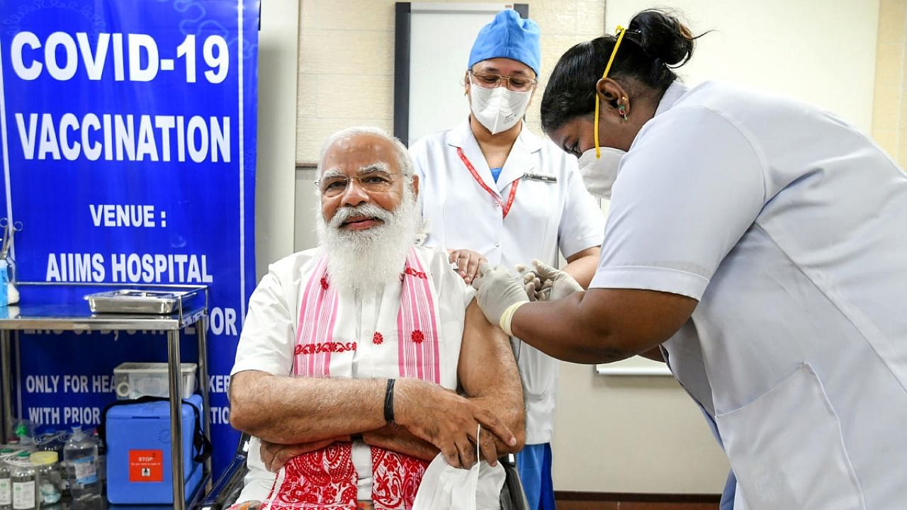 Prime Minister Narendra Modi being administered the first dose of Covid-19 vaccine, at AIIMS in New Delhi. Credit: PTI.