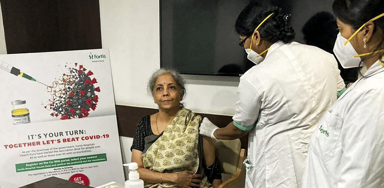 Union Finance Minister Nirmala Sitharaman receives her first dose of the Covid-19 vaccine. Credit: PTI photo. 