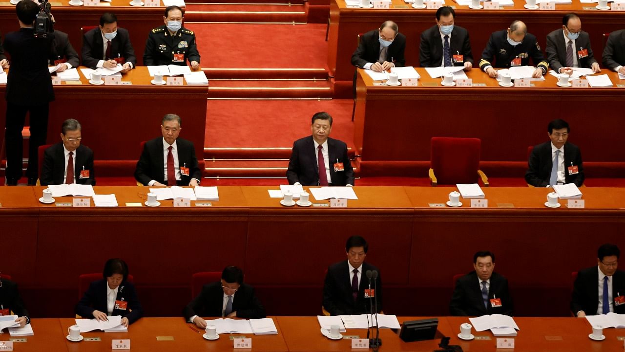 Chinese President Xi Jinping and other leaders attend the opening session of the National People's Congress (NPC) at the Great Hall of the People Credit: Reuters