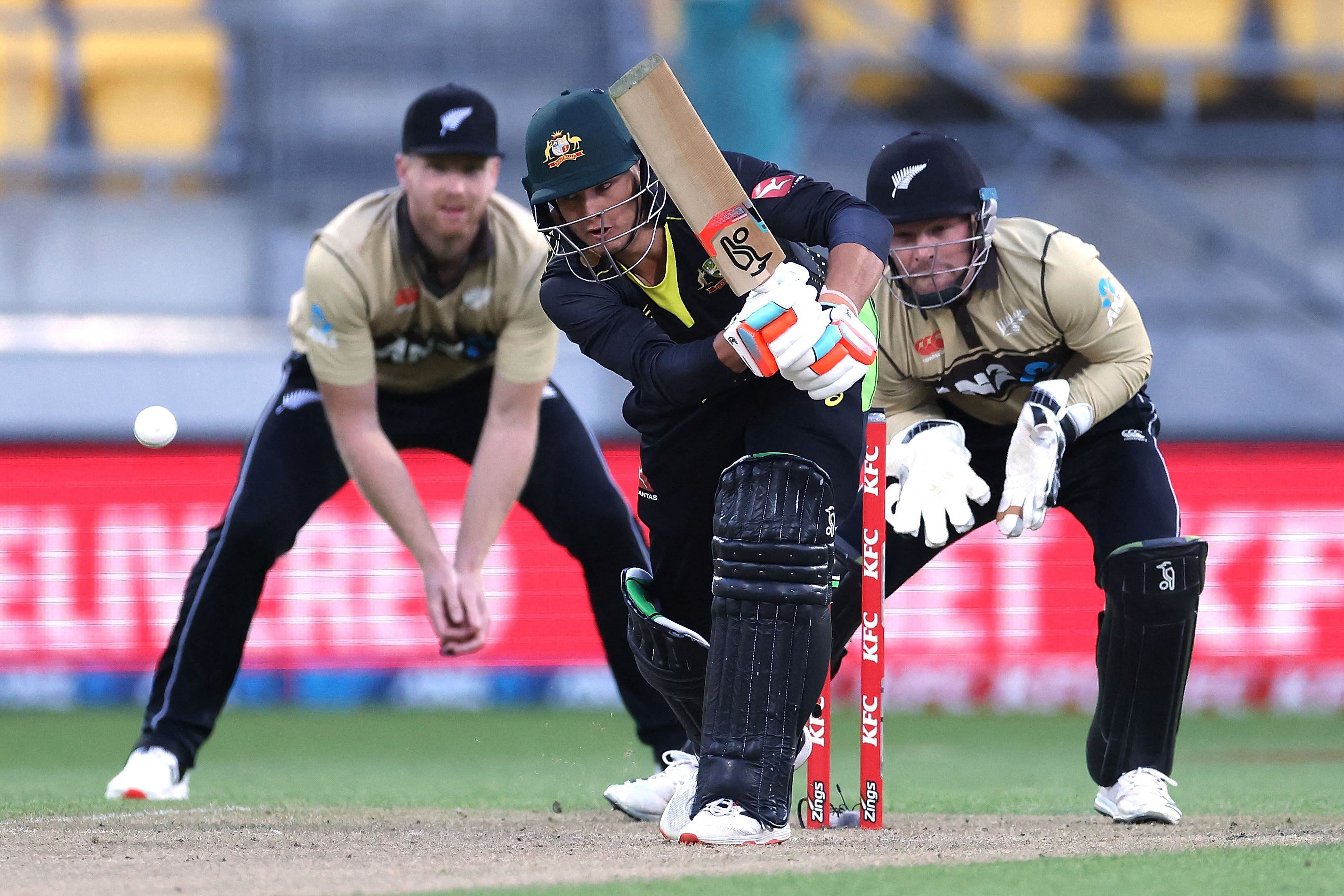 Australia's Josh Philippe plays a shot in front of New Zealand's wicket keeper Tim Seifert (R) during the fourth Twenty20 cricket match between New Zealand and Australia in Wellington on March 5, 2021. Credit: AFP Photo