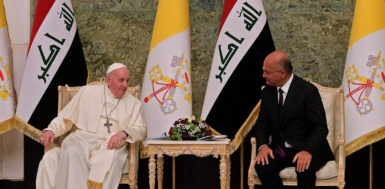 Iraqi President Barham Saleh meeting with Pope Francis at the presidential palace in Baghdad. Credit: AFP Photo