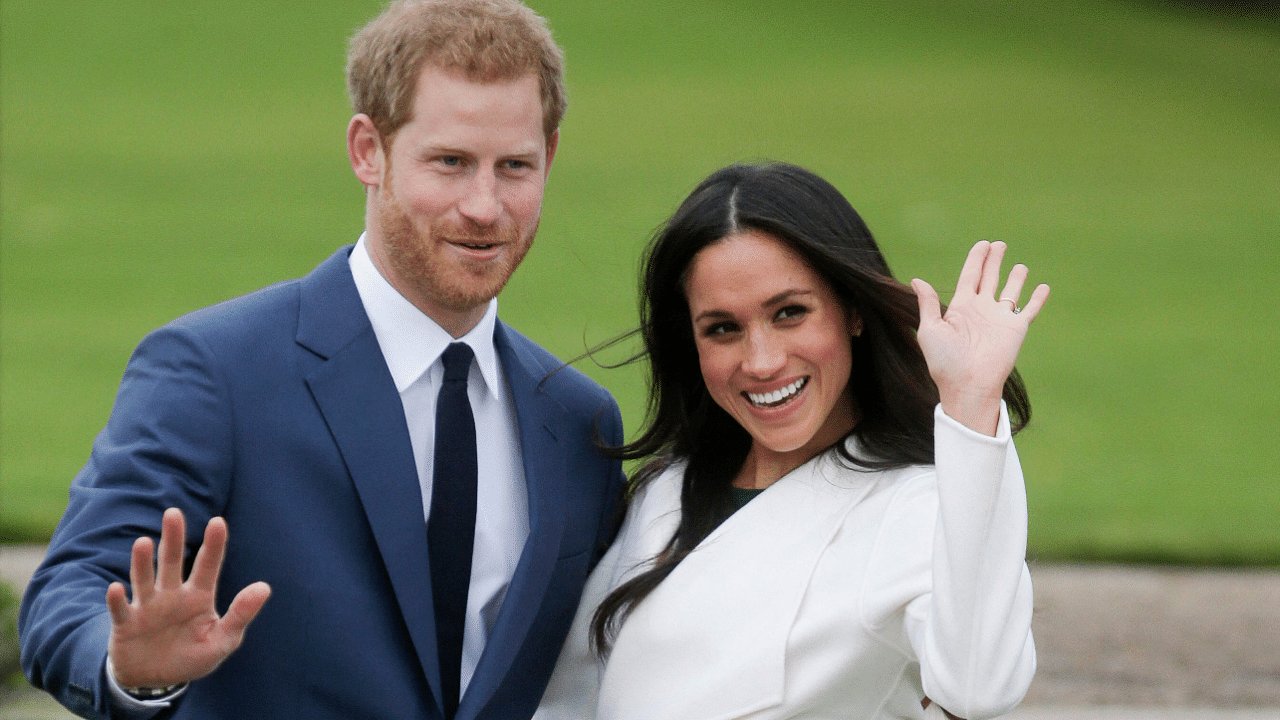 Britain's Prince Harry and his wife US actress Meghan Markle. Credit: AFP Photo