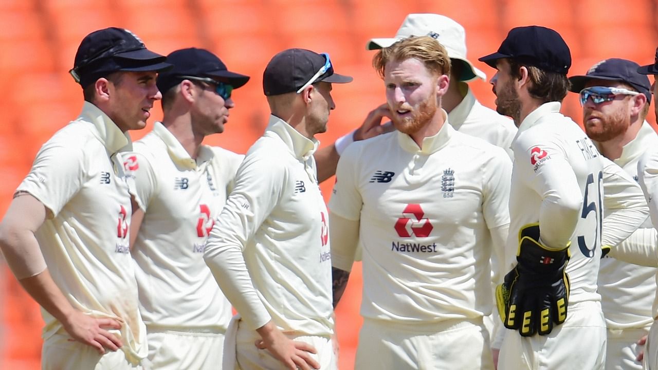 England bowler Ben Stokes (C) with teammates celebrates Indian batsman Rohit Sharma’s wicket, during second day’s play of the 4th and last cricket test match of the series between India and England. Credit: PTI Photo