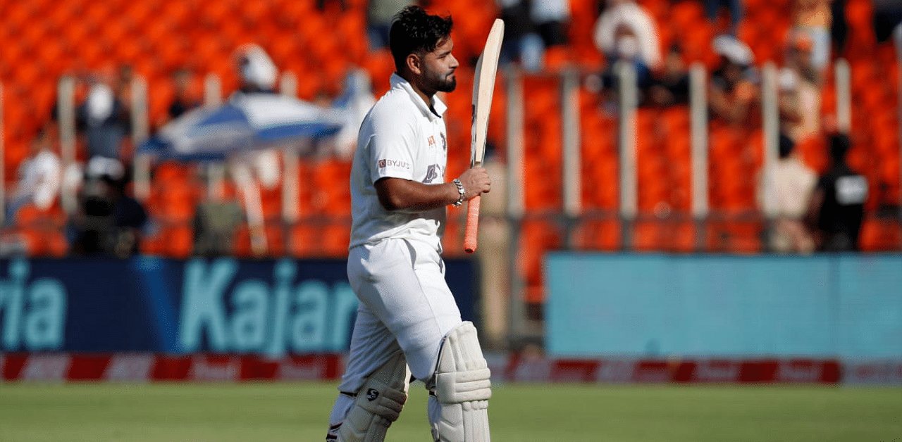 Rishabh Pant walks off the field after his dismissal. Credit: Reuters photo. 