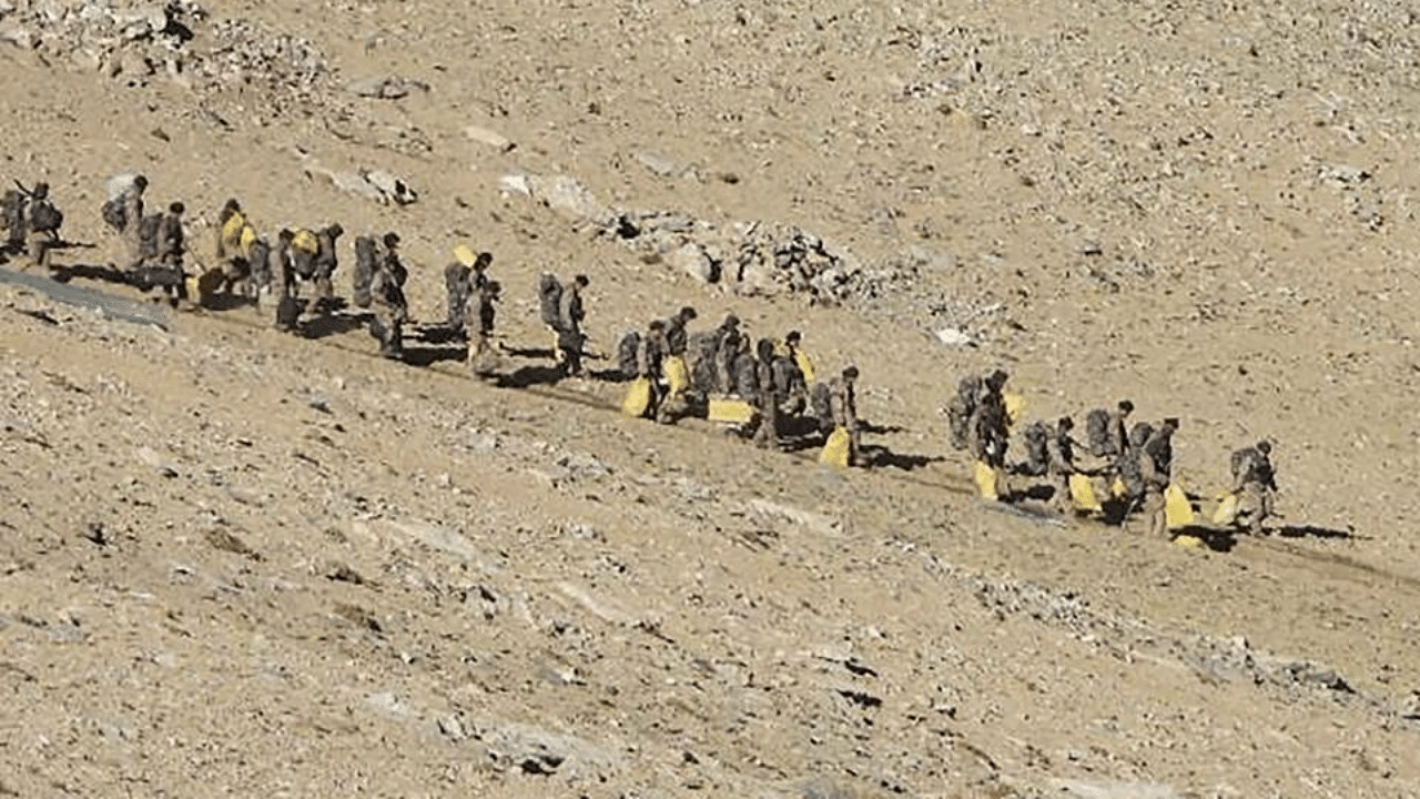 This file undated handout photograph released by the Indian Army on February 16, 2021 shows People Liberation Army (PLA) soldiers during military disengagement along the Line of Actual Control (LAC) at the India-China border in Ladakh. Credit: AFP 