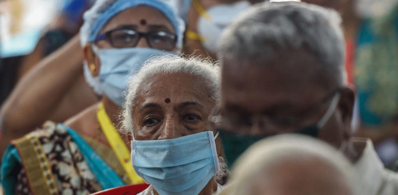 Senior citizens wait to receive the Covid-19 vaccine at the Rajawadi hospital in Mumbai. Credit: AFP photo. 
