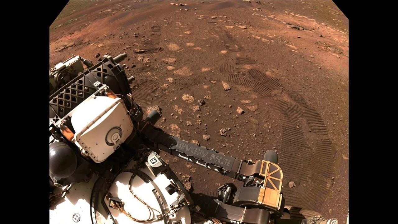 This NASA image released on March 5, 2021, was captured while NASA's Perseverance rover drove on Mars for the first time on March 4, 2021. Credit: AFP/NASA/JPL-Caltech.