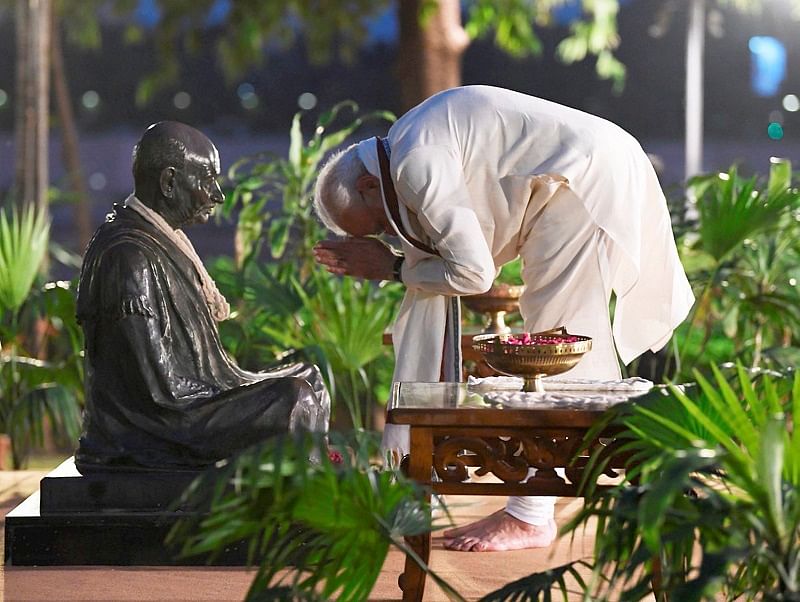 Prime Minister Narendra Modi pays homage to Mahatma Gandhi, on his 150th birth anniversary, at Sabarmati Ashram in Ahmedabad. (PTI Photo)