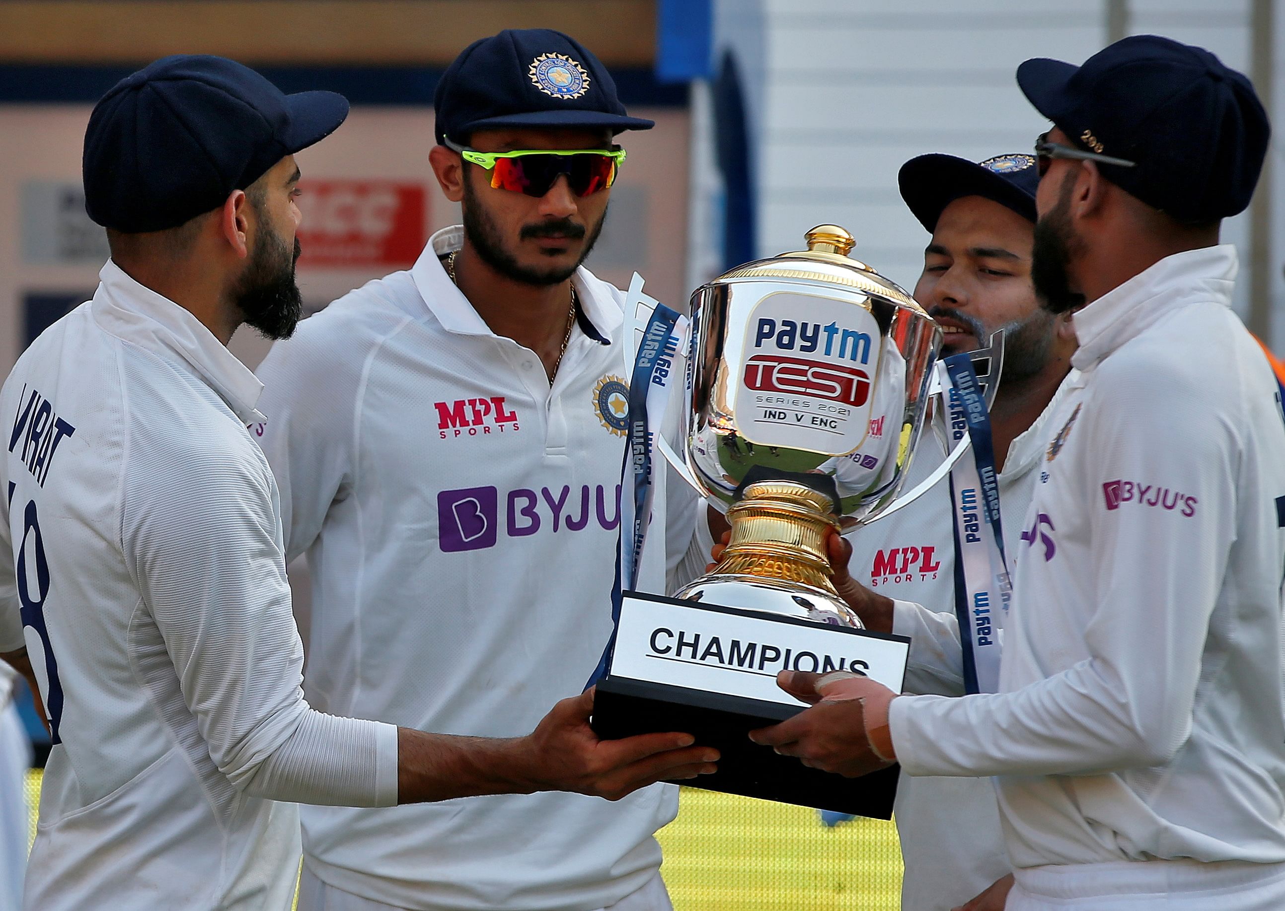 India's captain Virat Kohli, Axar Patel, Rishabh Pant and Mohammed Siraj hold the trophy. Credit: REUTERS Photo