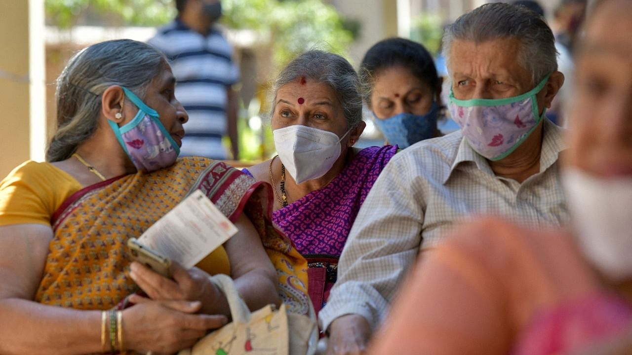 Senior citizens wait to receive a Covid-19 coronavirus vaccine at a government hospital in Bangalore on March 5, 2021. Credit: AFP Photo