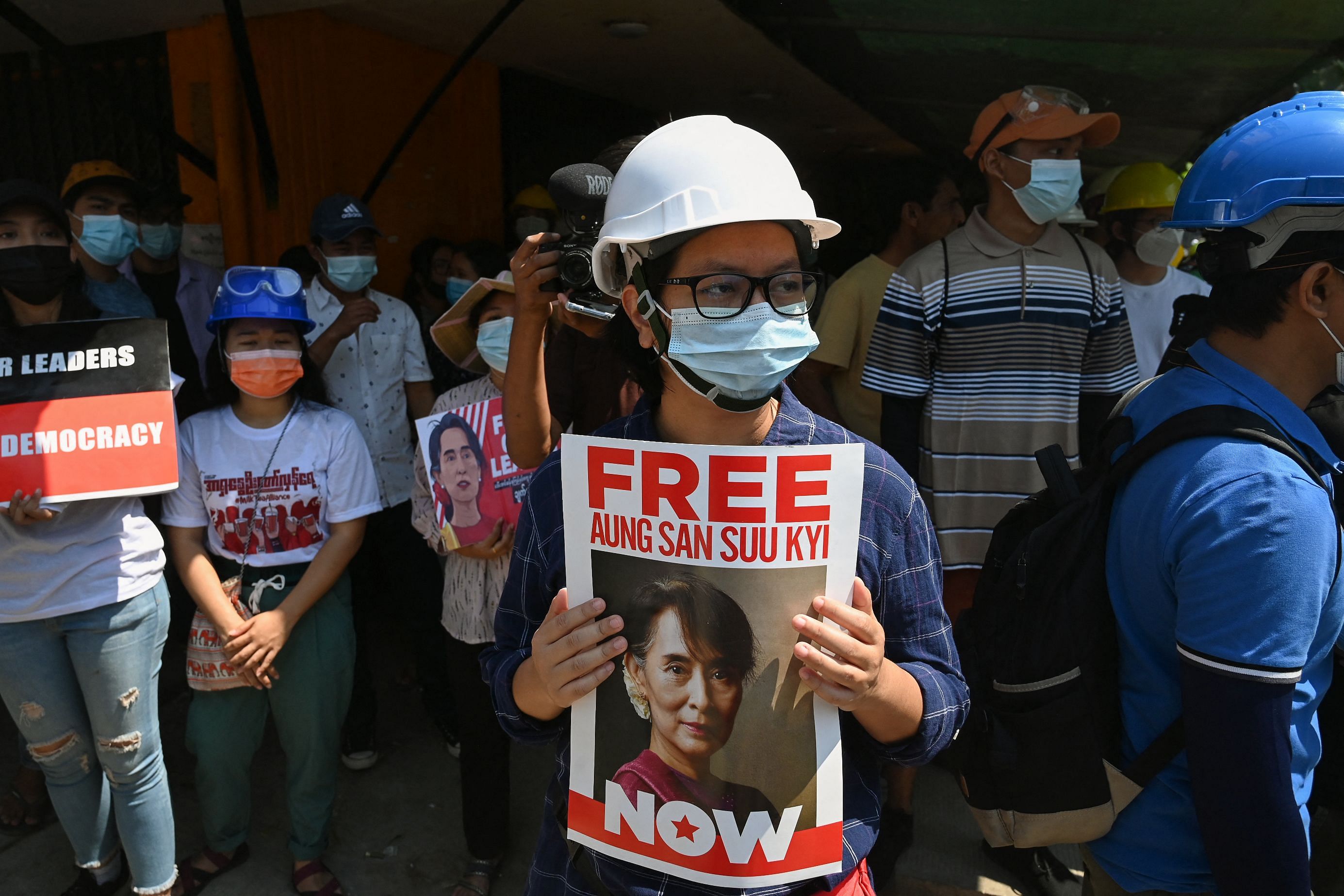 A protester holds a sign calling for the release of detained Myanmar civilian leader Aung San Suu Kyi during a demonstration against the military coup in Yangon on March 7, 2021. Credit: AFP Photo