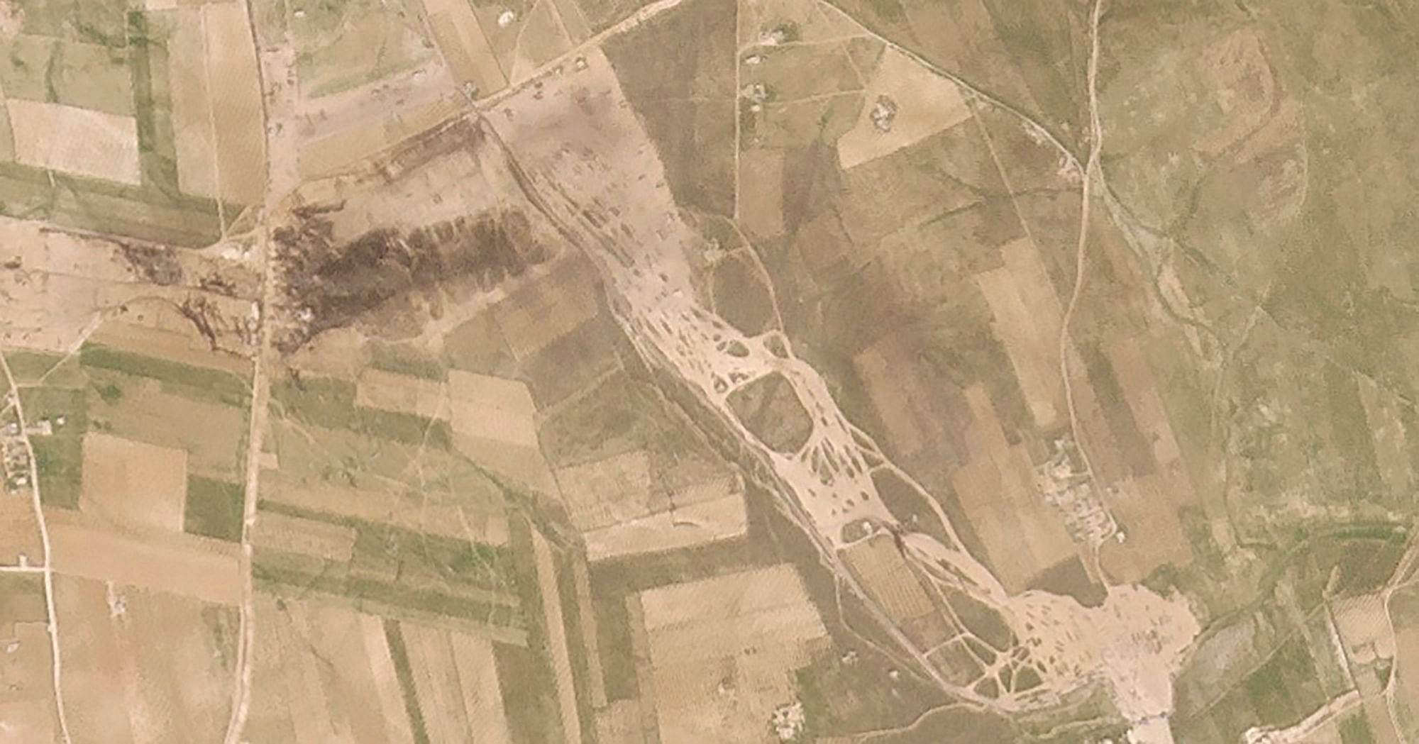 This Saturday, March 6, 2021, satellite photo from Planet Labs Inc. shows the aftermath of a fire following a suspected missile strike on an oil-loading facility just northwest of the city of Manbij, Syria. A suspected Russian missile strike targeted an oil site used by opposition forces in Syria early Saturday morning. Credit: AP/PTI