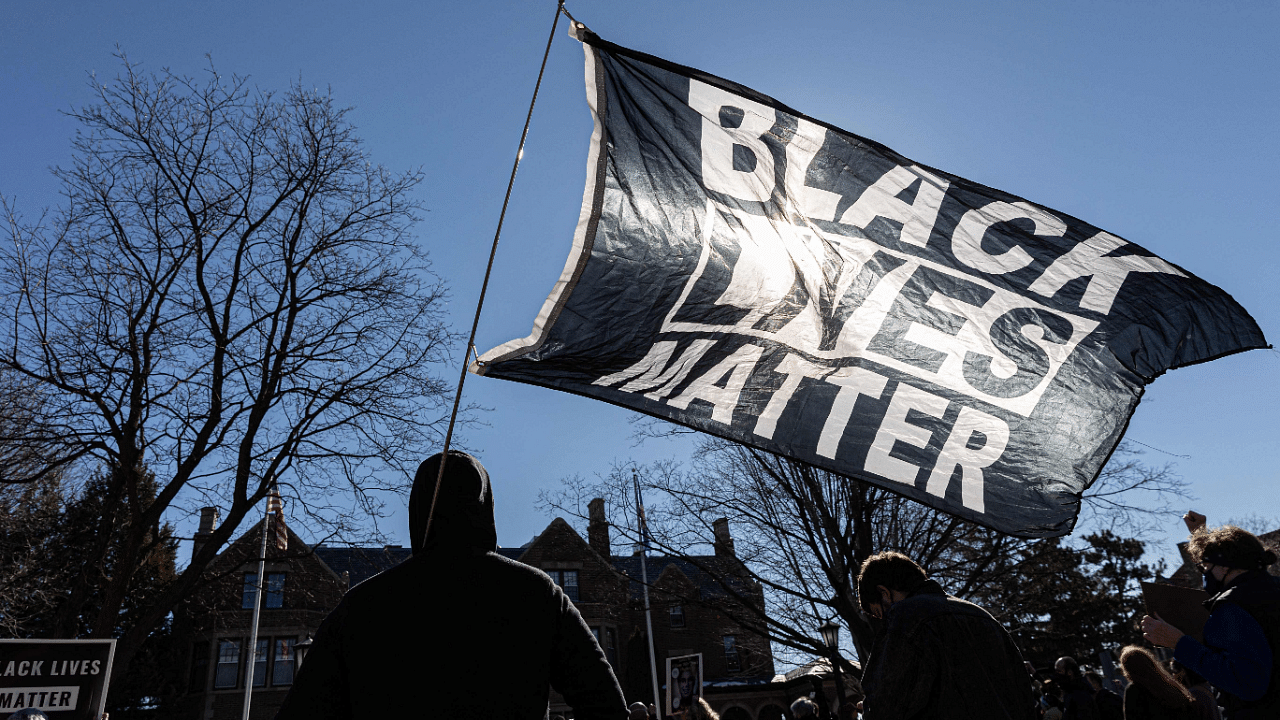 A man holds a Black Lives Matter flag during the protest against George Floyd's death in US. Credit: AFP Photo