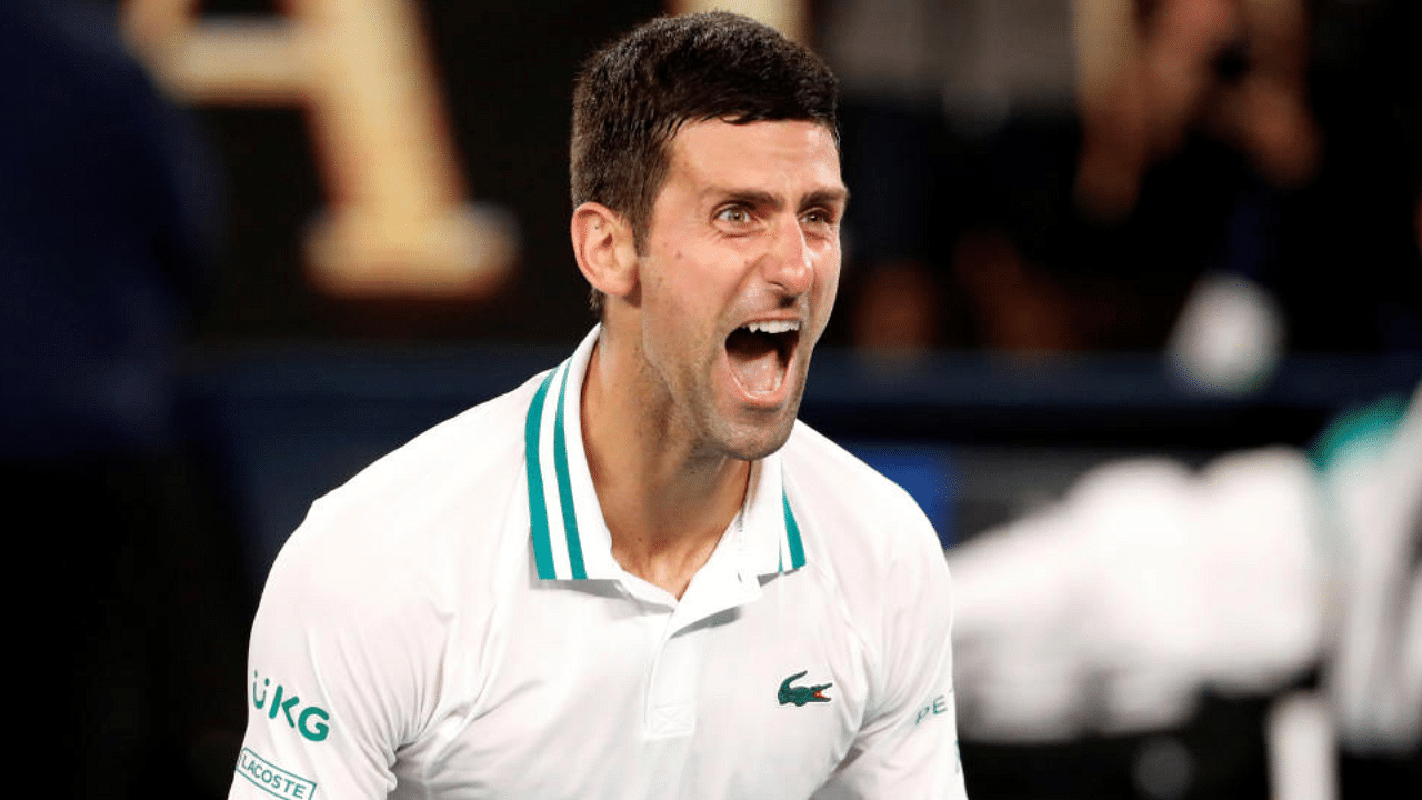 Serbia's Novak Djokovic celebrates winning his final match against Russia's Daniil Medvedev in Australian Open. Credit: Reuters Photo