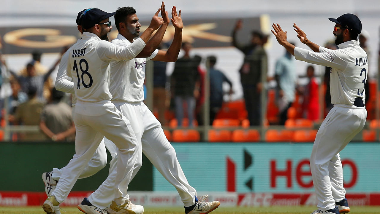 India's Ravichandran Ashwin celebrates with captain Virat Kohli and Ajinkya Rahane after taking the wicket of England's Jonny Bairstow. Credit: REUTERS Photo