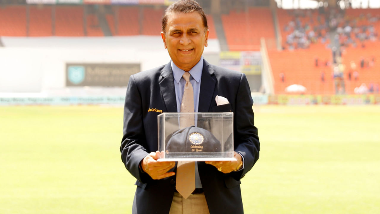 Indian batting great Sunil Gavaskar with a commemorative Test cap after he was felicitated on the 50th anniversary of his Test debut. Credit: Twitter/@BCCI
