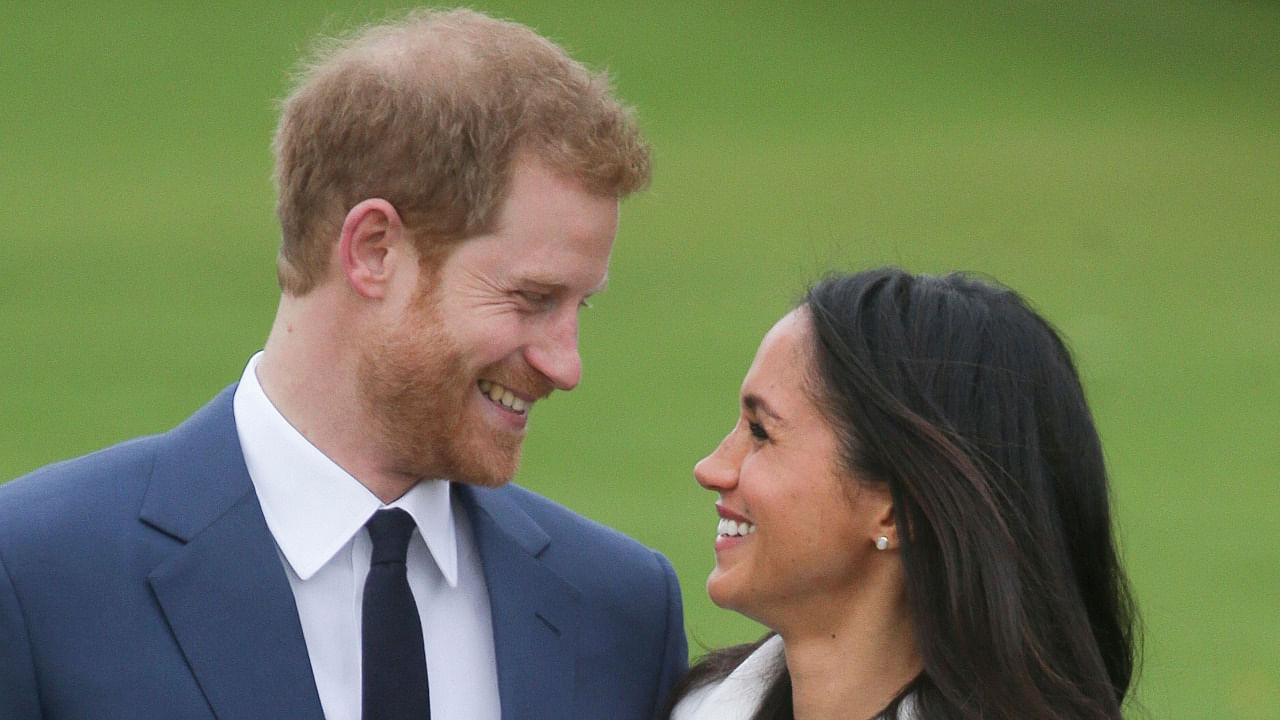 Britain's Prince Harry and his wife Meghan Markle. Credit: AFP File Photo