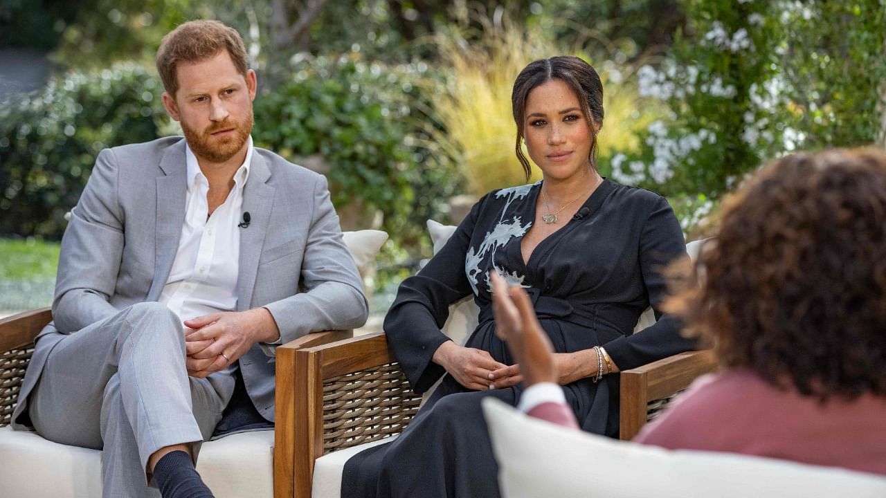 Prince Harry (L0 and his partner Meghan Markle revealed to Oprah Winfrey that they did everything they could to stay in the royal family. Credit: AFP Photo