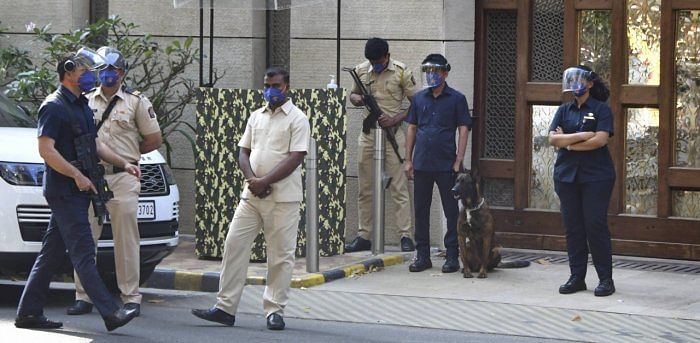 Police personnel guard outside industrialist Mukesh Ambani's residence Antilla, a day after explosives were found in an abandoned car in its vicinity, in Mumbai on Friday, Feb. 26, 2021. Credit: PTI Photo