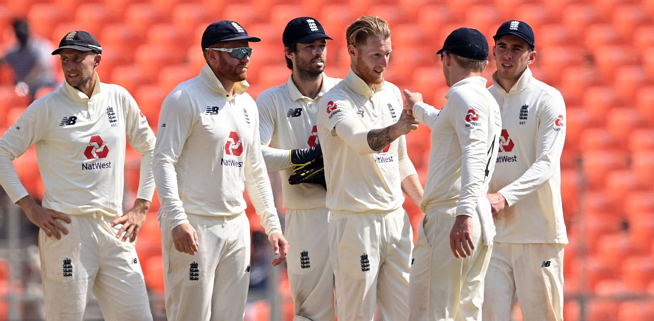 Ben Stokes (C) celebrates with teammates after the dismissal of India's Ishant Sharma in the third day of the 4th Test match. Credit: AFP Photo