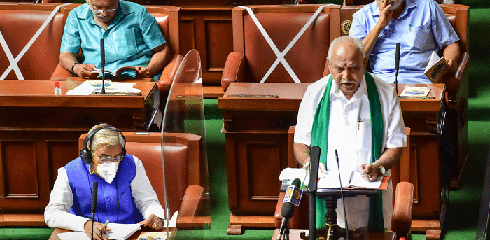 Karnataka Chief Minister B S Yediyurappa presents the State Budget 2021-22 in the Vidhana Soudha, Bengaluru. Credit: PTI Photo