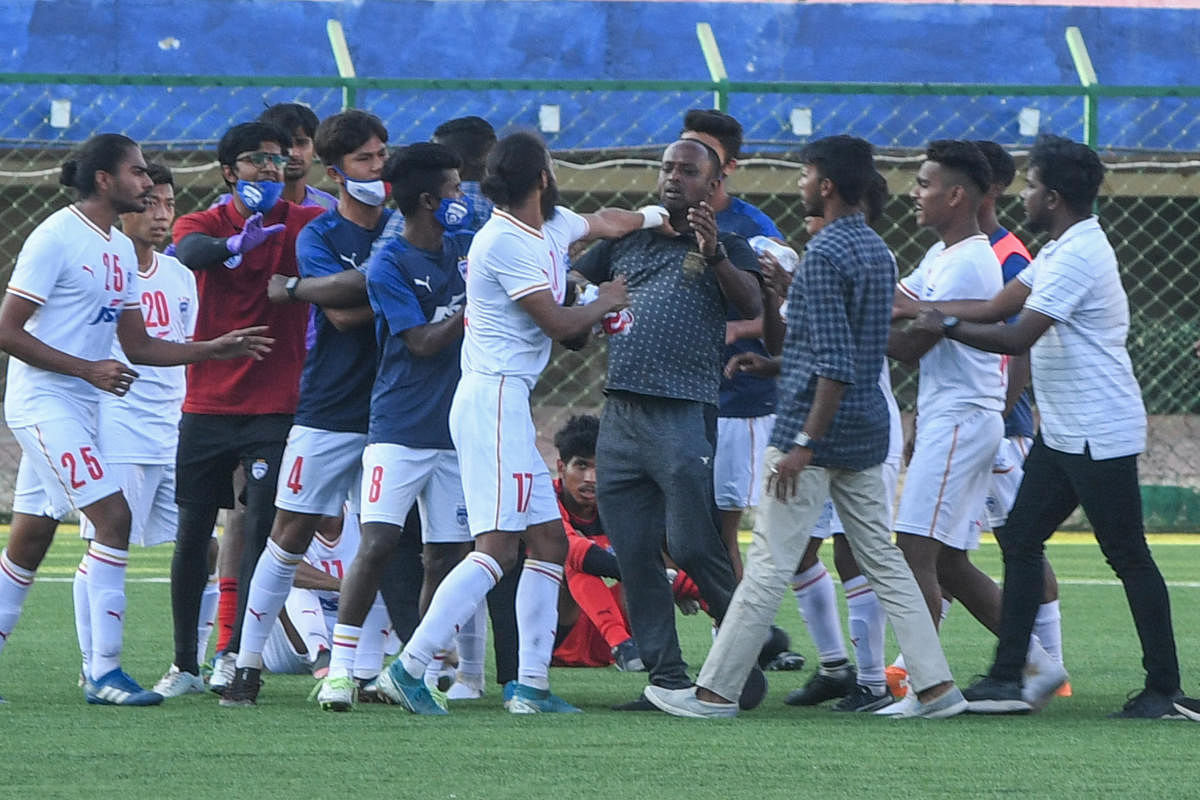 BFC players scuffle with people who came to the rescue of referee Suresh Devraj (not in pic) after their match against FC Bengaluru United in Bengaluru on Monday. Credit: DH Photo