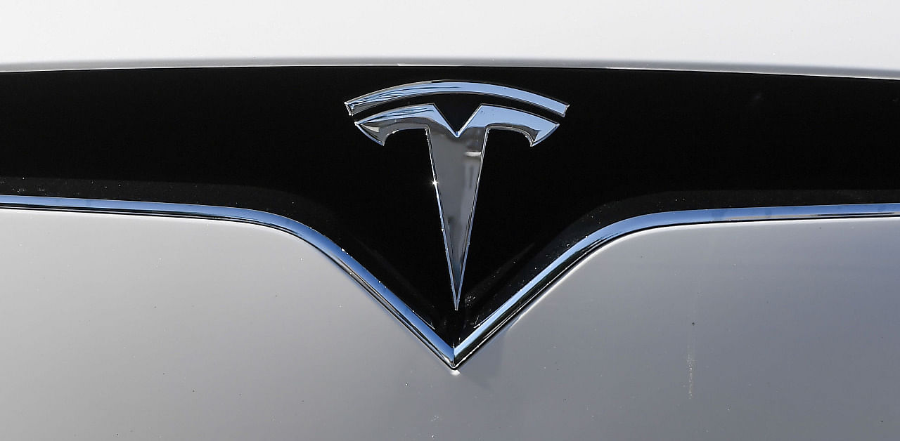 A logo of car manufacturer Tesla on a vehicle. Credit: AFP Photo