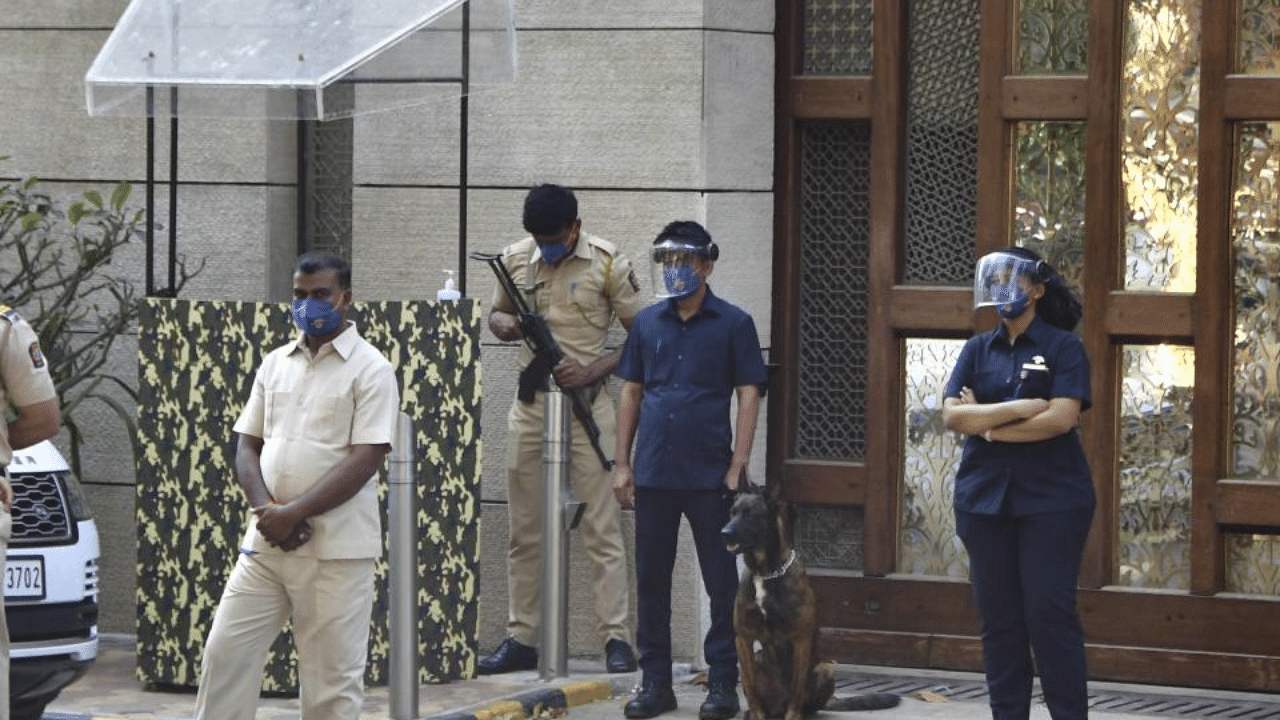 Police personnel guard outside industrialist Mukesh Ambani's residence Antilla, a day after explosives were found in an abandoned car in its vicinity, in Mumbai on Friday, Feb. 26, 2021. Credit: PTI Photo
