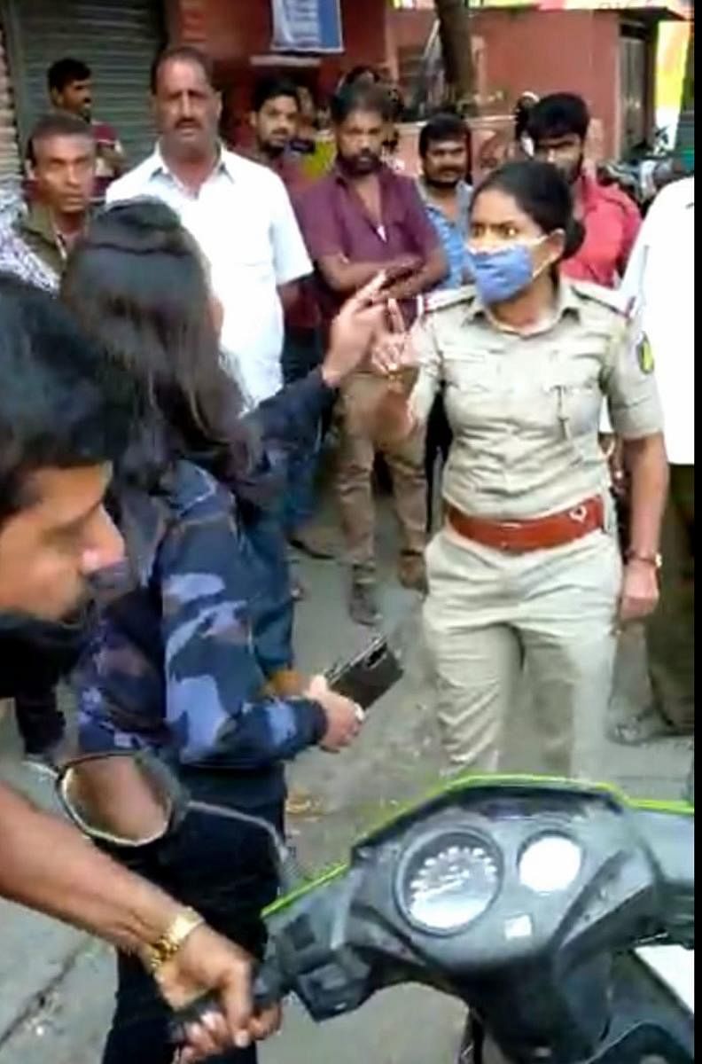 A video grab of the argument between the girl and the women cop, in Mandya.