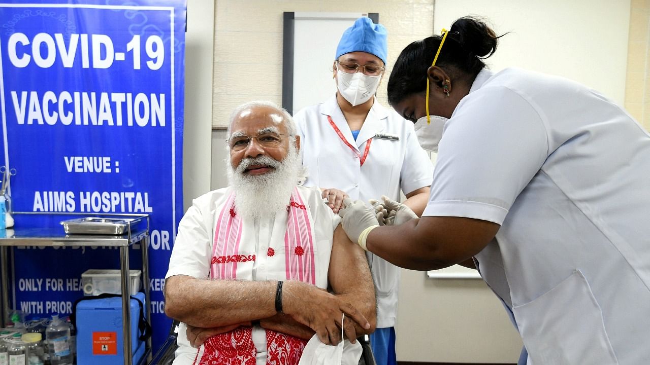 Prime Minister Narendra Modi receives a dose of Covaxin, a coronavirus vaccine developed by India's Bharat Biotech and the state-run ICMR, at AIIMS hospital in New Delhi. Credit: Reuters/PIB