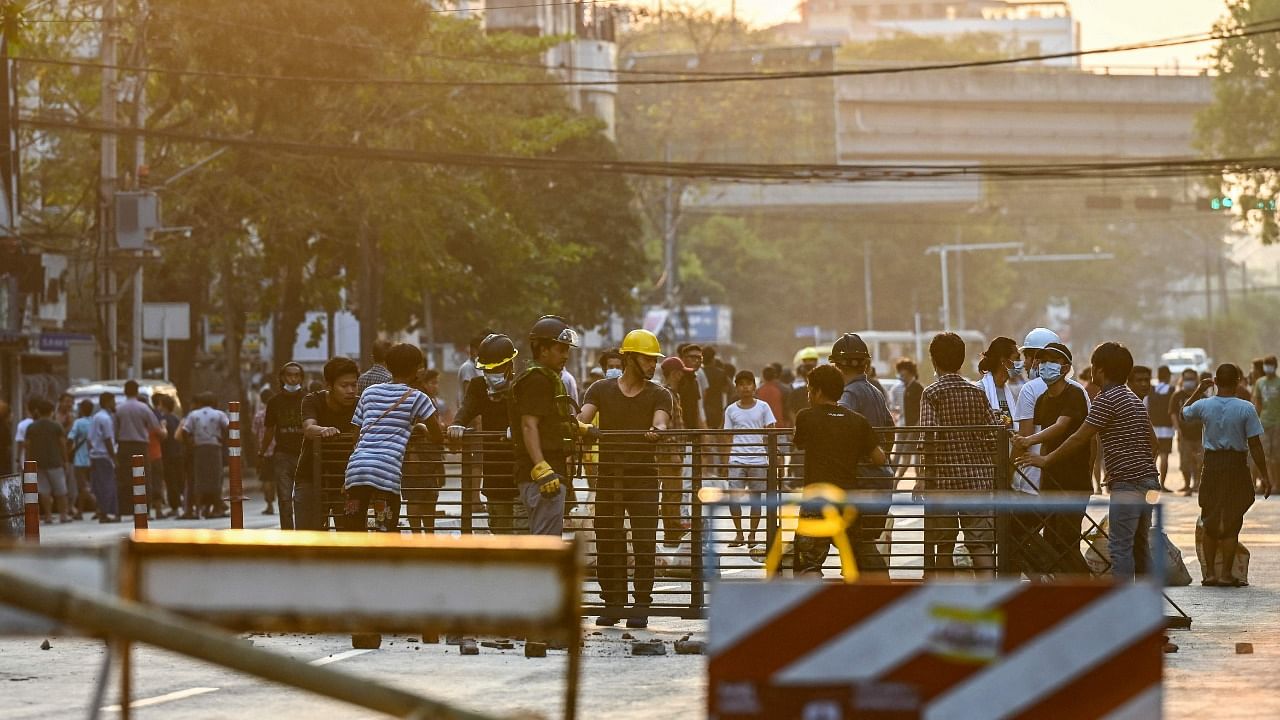 Protesters erect makeshift barricades in Yangon on March 10, 2021, as security forces continue to crackdown on demonstrations against the military coup. Credit: AFP Photo