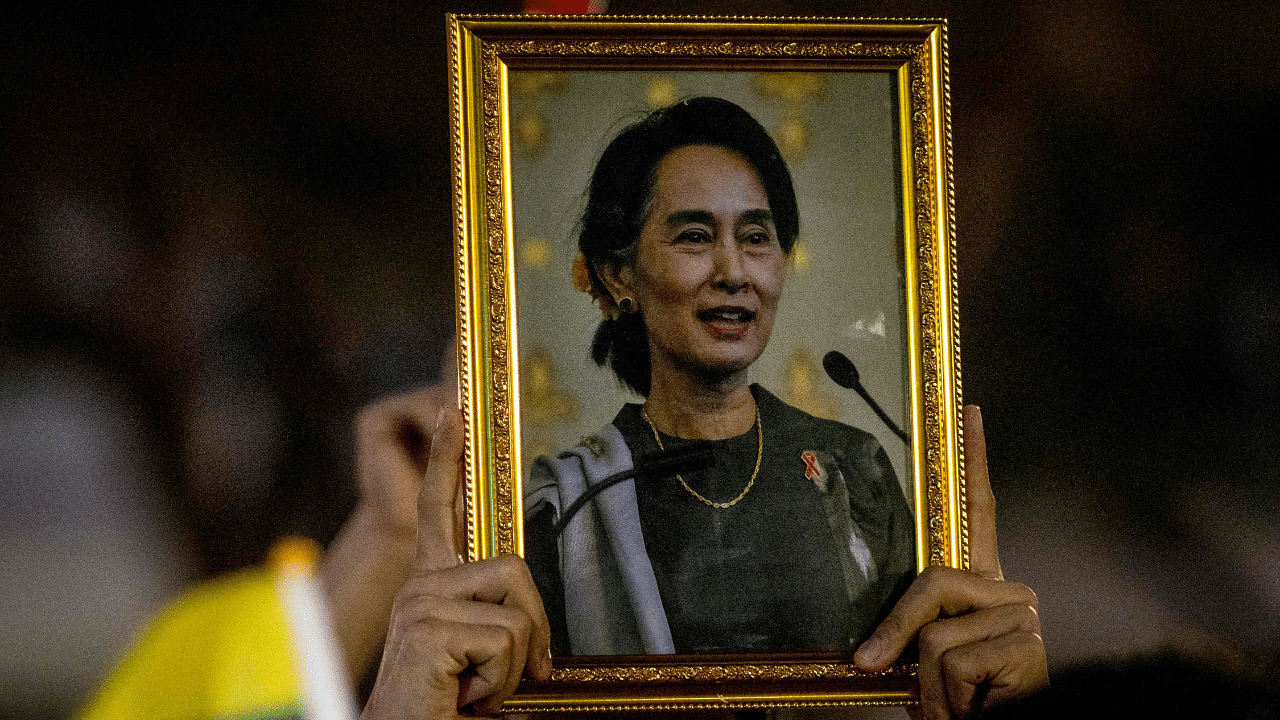 A protester holds up a picture of detained Myanmar civilian leader Aung San Suu Kyi. Credit: AFP Photo