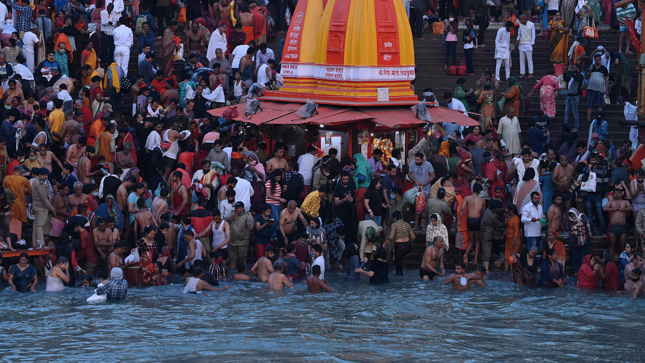 Hindu devotees take a holy dip in the waters of the River Ganges on the Shahi Snan (grand bath) on the occasion of Maha Shivratri festival. Credit: AFP Photo