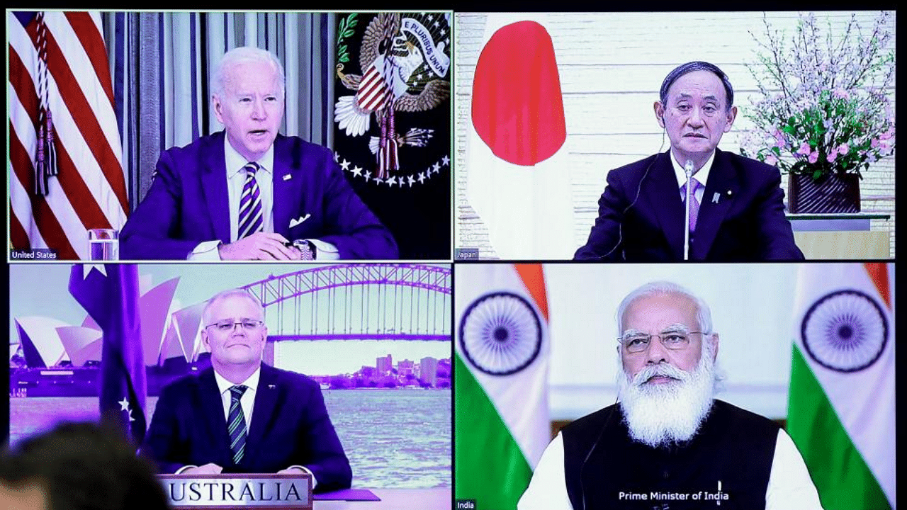 A monitor displaying the virtual meeting of U.S. President Joe Biden (top L), Australia's Prime Minister Scott Morrison (bottom L), Japan's Prime Minister Yoshihide Suga (top R) and India's Prime Minister Narendra Modi is seen during the virtual Quadrilateral Security Dialogue (Quad) meeting, at Suga's official residence in Tokyo on March 12, 2021. Credit: AFP Photo