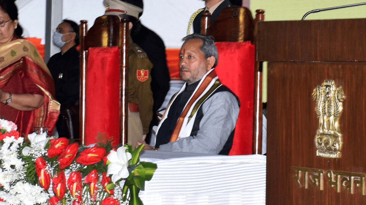 Uttarakhand Governor Baby Rani Maurya administes oath of office to state ministers in the presence of new state CM Tirath Singh Rawat, in Dehradun, Friday, March 12, 2021. Credit: PTI Photo