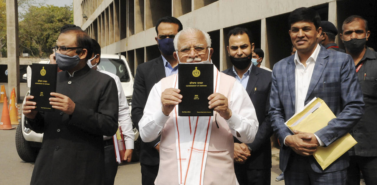 Haryana Chief Minister Manohar Lal Khattar arrives to present the state's budget for the financial year 2021-2022 in the state assembly. Credit: PTI Photo