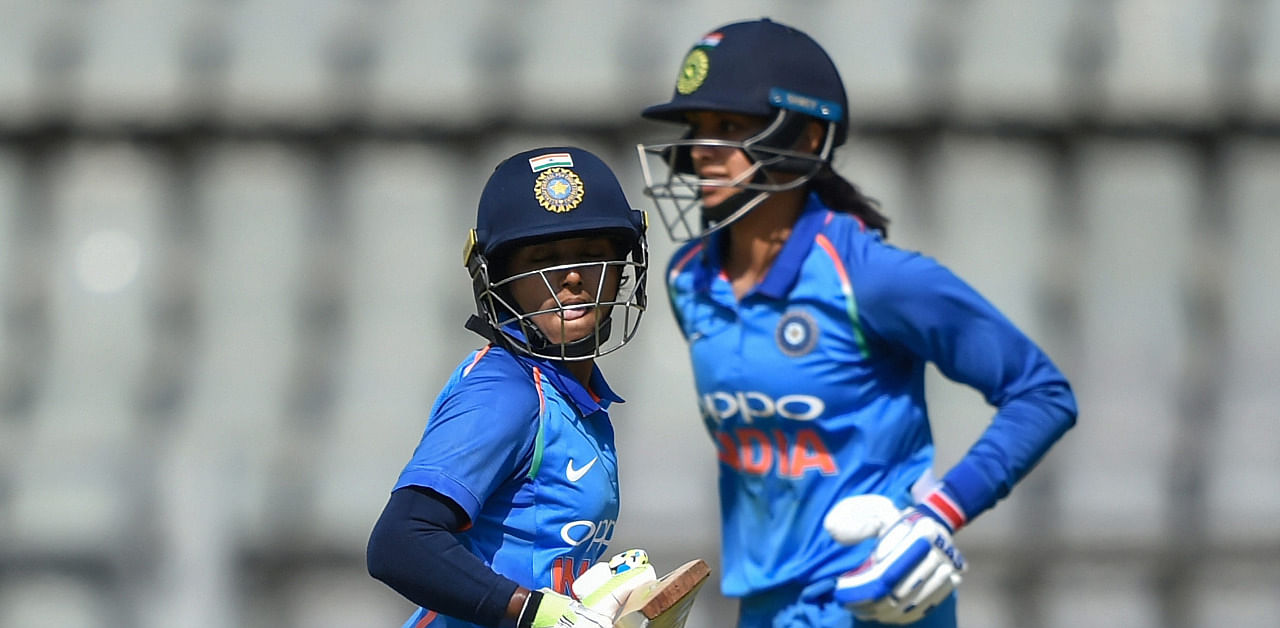 Punam Raut and Smriti Mandhana in match against England. Credit: PTI File Photo