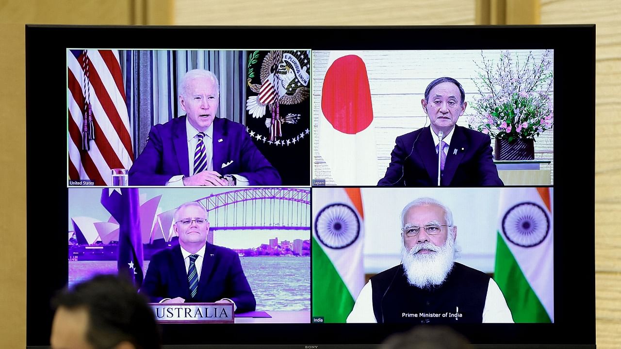 A monitor displaying the virtual meeting of US President Joe Biden (top L), Australia's Prime Minister Scott Morrison (bottom L), Japan's Prime Minister Yoshihide Suga (top R) and India's Prime Minister Narendra Modi is seen during the virtual Quadrilateral Security Dialogue (Quad) meeting. Credit: AFP Photo