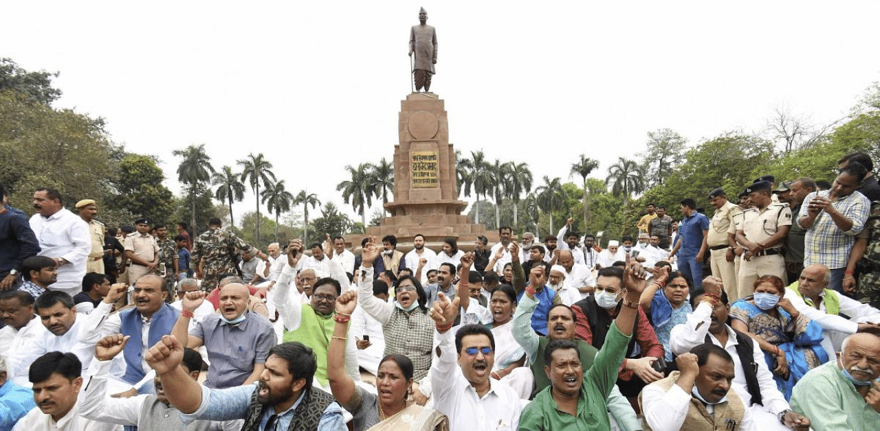 Grand alliance legislators shout slogans outside Raj Bhawan on liquor prohibition issue, during the Budget Session of Bihar Assembly, in Patna. Credit: PTI Photo