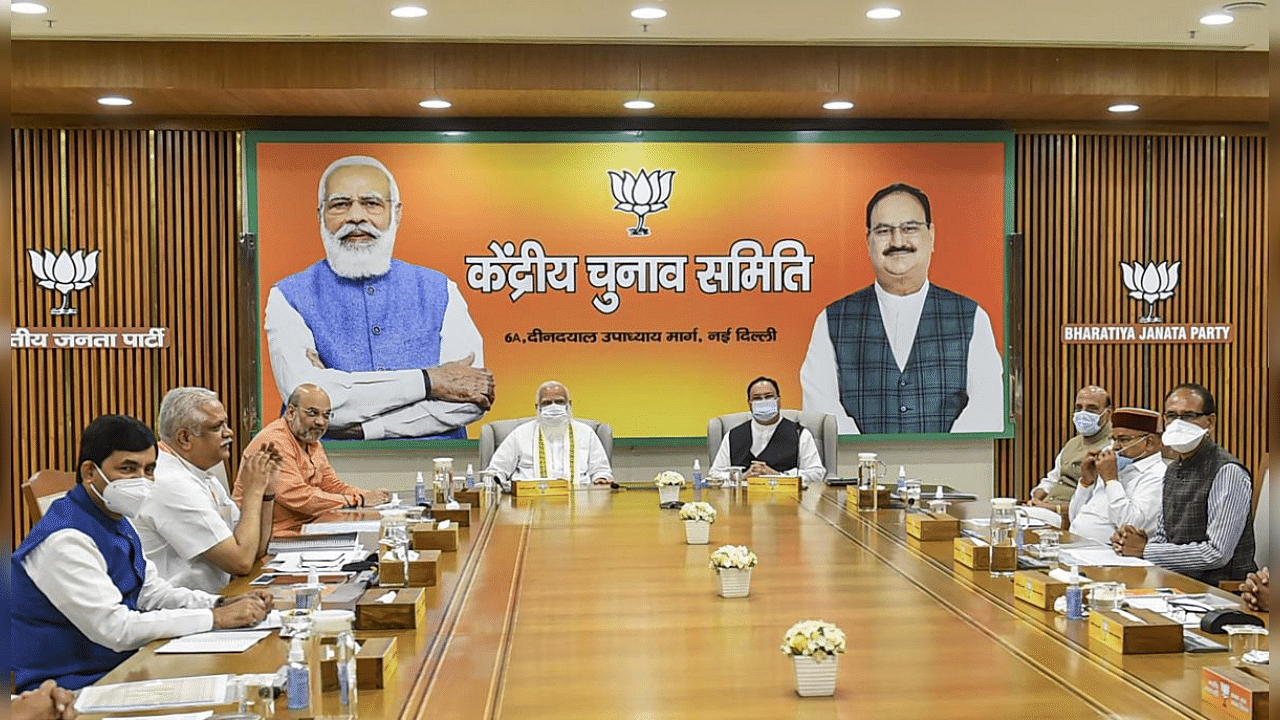 Prime Minister Narendra Modi chairs BJP's Central Election Committee (CEC) meeting, in New Delhi, Saturday, March 13, 2021. Union Home Minister Amit Shah and BJP National President JP Nadda are also seen. Credit: PTI Photo