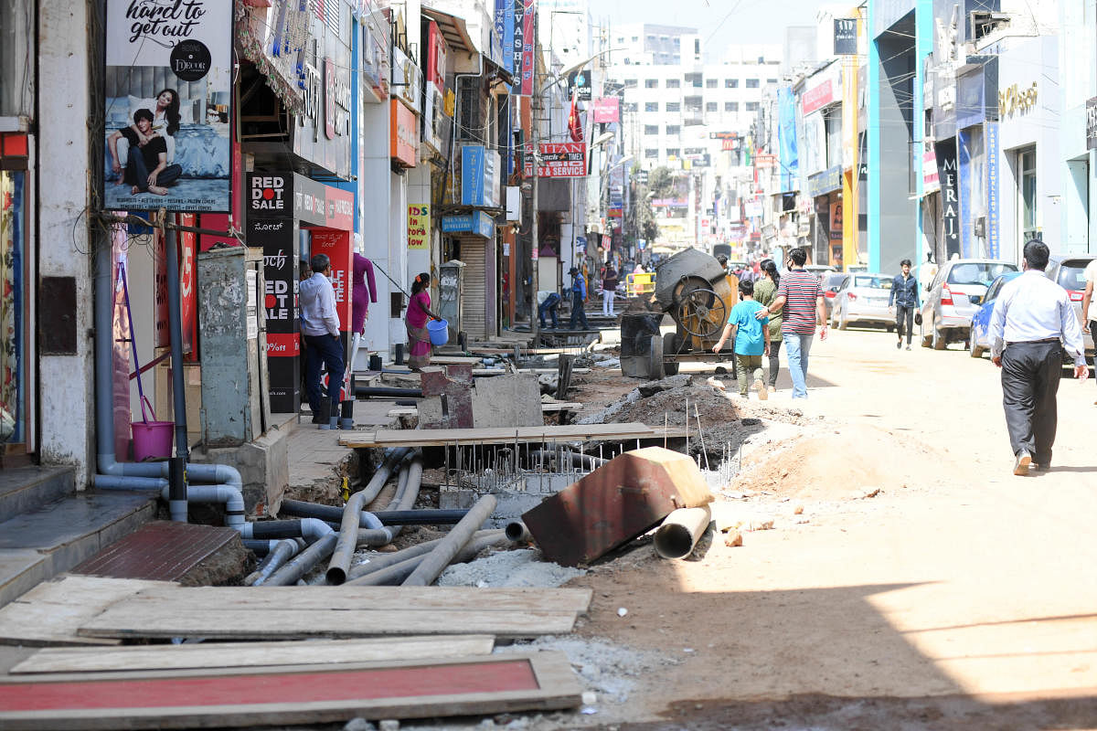 Lack of parking, coupled with roads being due dug-up for the smart city work, are making people vary of visiting Commercial Street, says shop owners. DH Photo BH Shivakumar