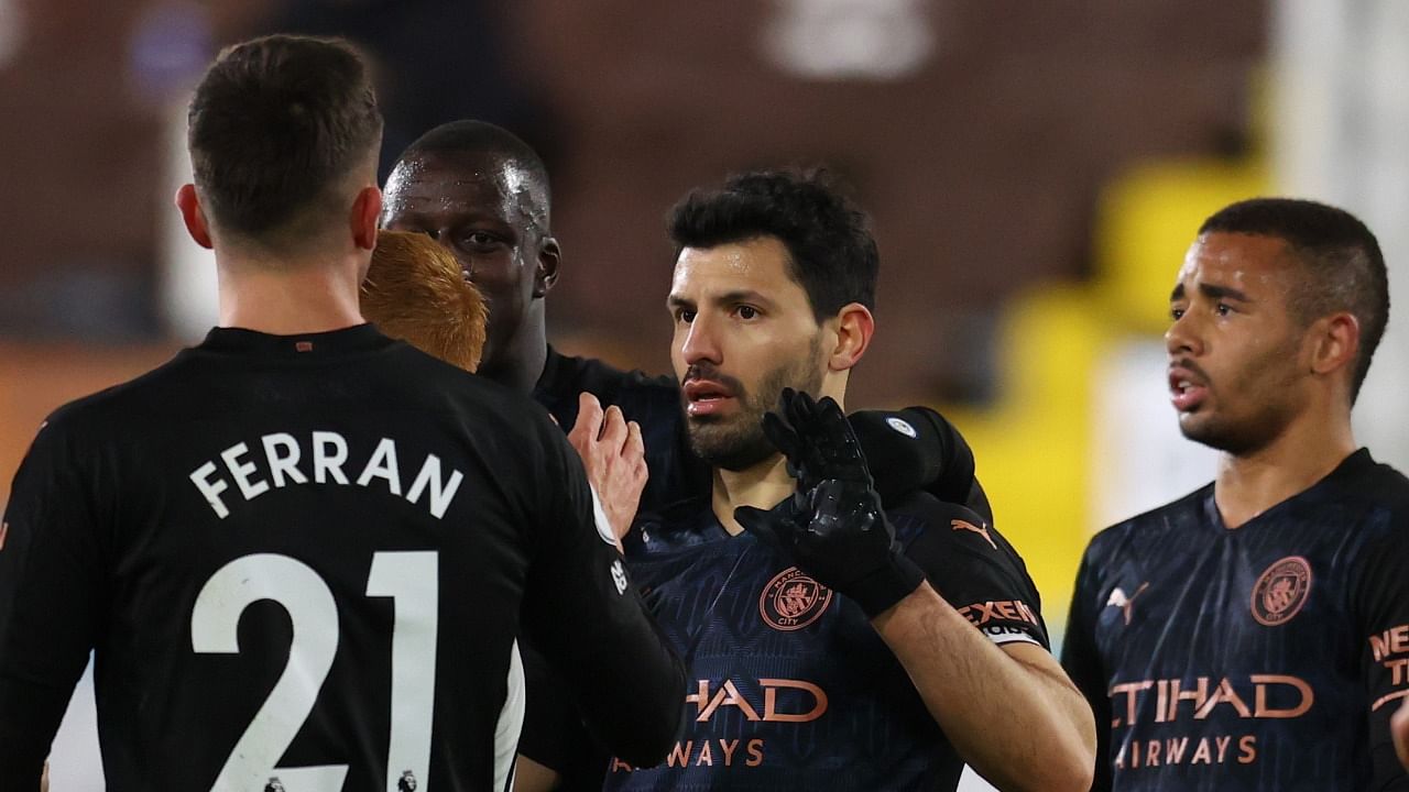 Manchester City's Sergio Aguero celebrates scoring their third goal against Fulham with teammates at the Craven Cottage in London. Credit: Reuters Photo