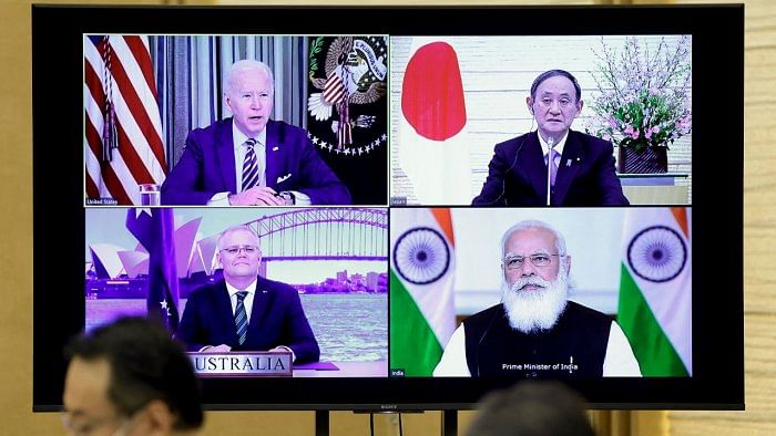 A monitor displaying the virtual meeting of US President Joe Biden (top L), Australia's Prime Minister Scott Morrison (bottom L), Japan's Prime Minister Yoshihide Suga (top R) and India's Prime Minister Narendra Modi is seen during the virtual Quadrilateral Security Dialogue (Quad) meeting, at Suga's official residence in Tokyo on March 12, 2021. Credit: AFP Photo