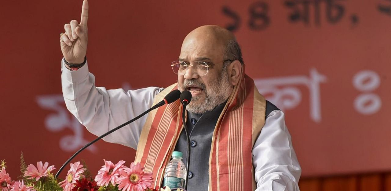 Home Minister Amit Shah addresses an election campaign rally ahead of the Assam Assembly Polls, at Margherita in Tinsukia District of Assam, Sunday, March 14, 2021. Credit: PTI Photo